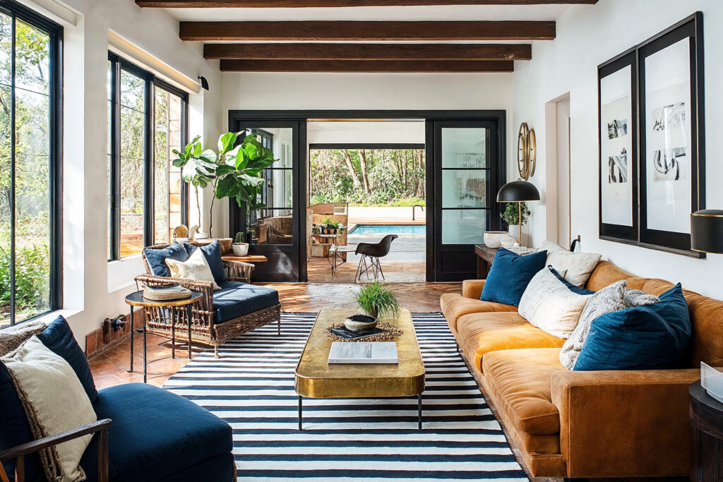Stylish living room with large windows and pool view - Singapore luxury homes
