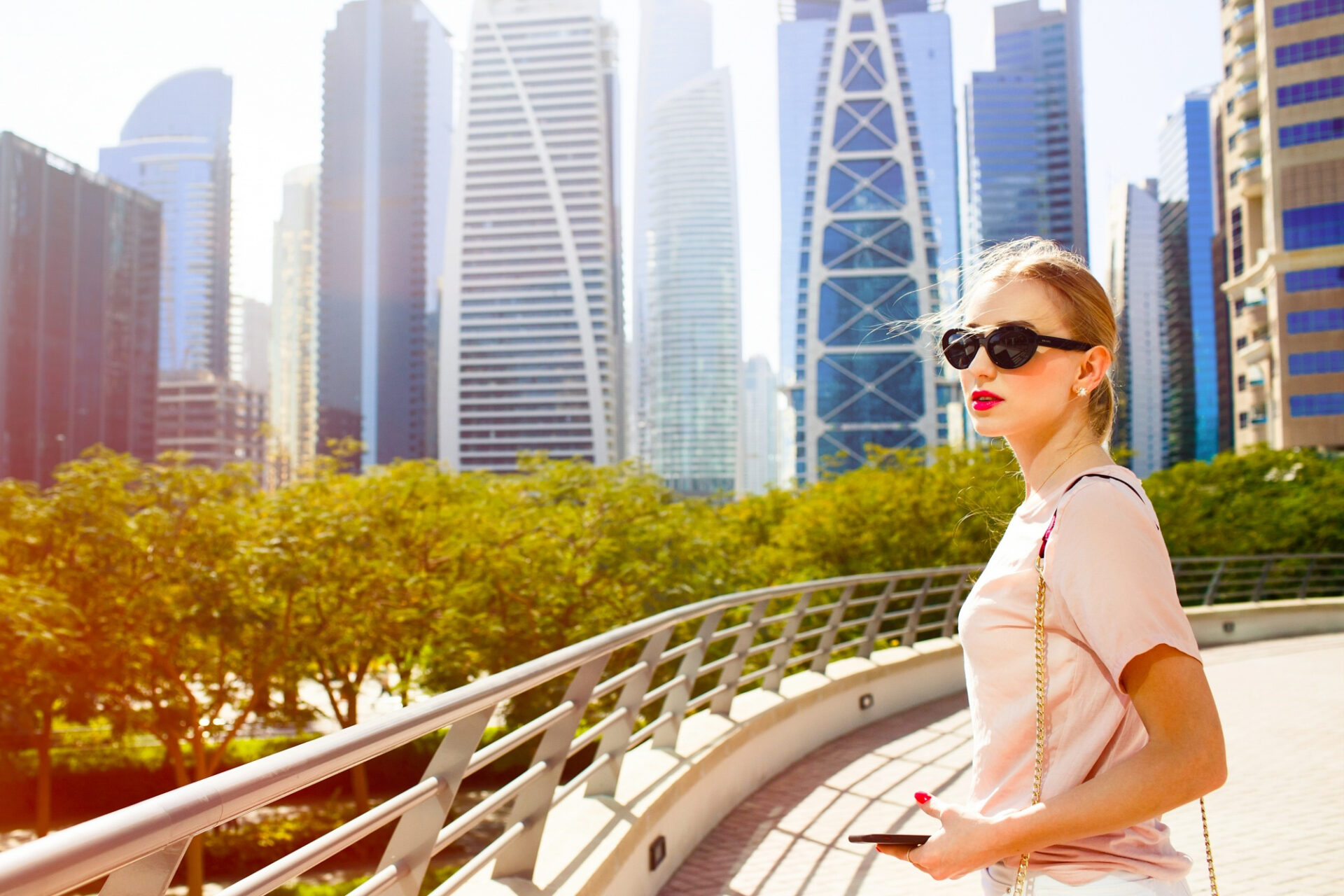 Foreign buyer exploring Dubai real estate market with modern skyscrapers in the background