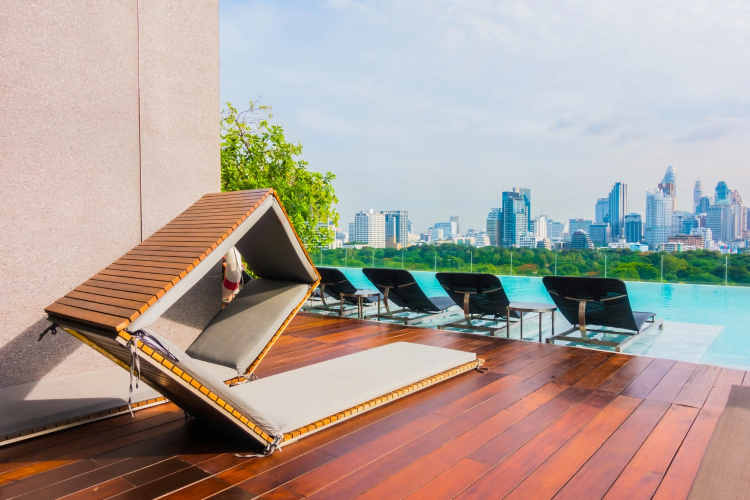 Infinity pool and city skyline view from modern wellness condominium Singapore