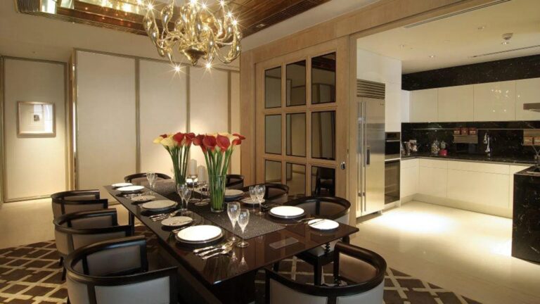Ritz-Carlton Residences Penthouse dining area with luxury chandelier and modern kitchen